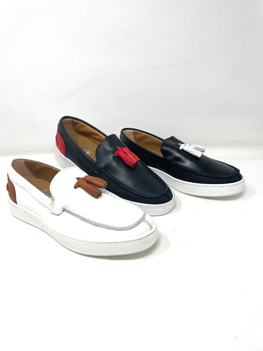 Two-tone leather tassel boat moccasin with stitched rubber sole