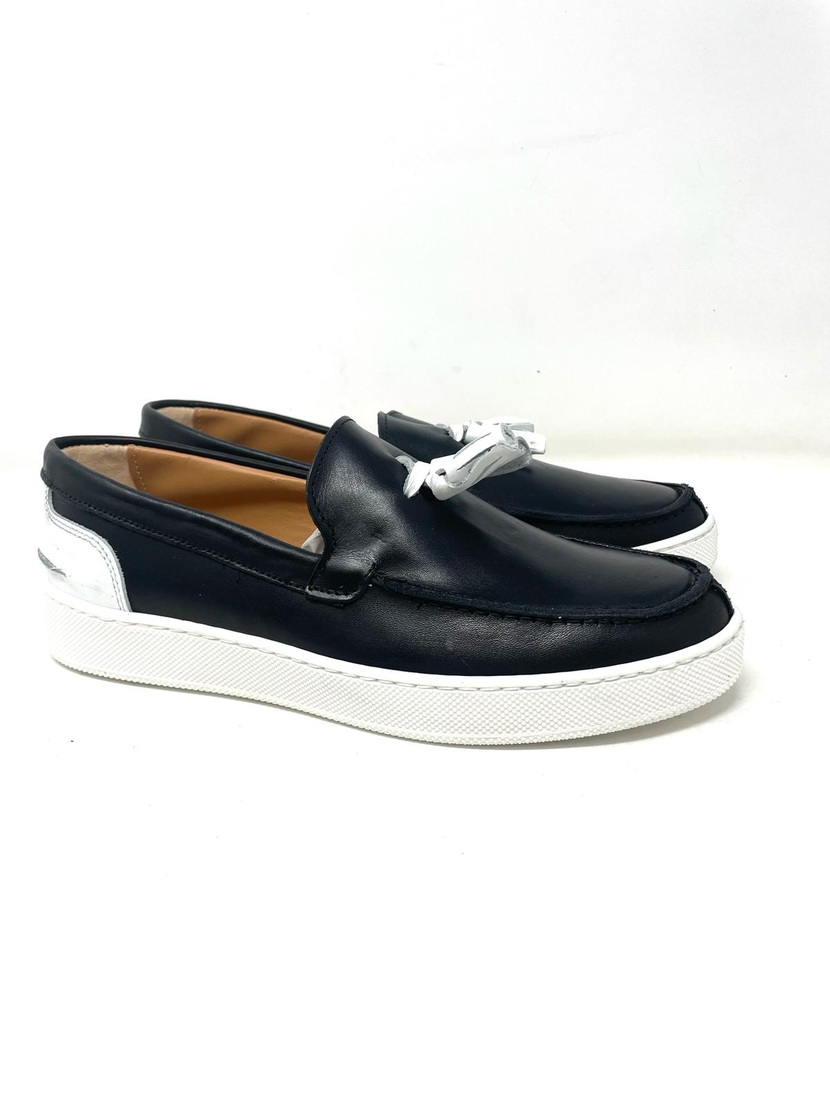 Two-tone leather tassel boat moccasin with stitched rubber sole